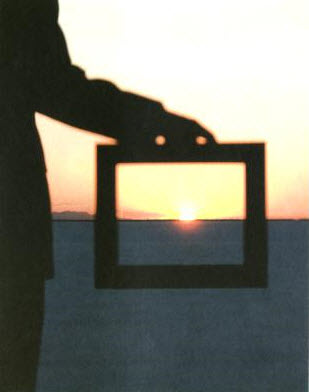 holding-frame-with-sunset